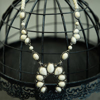 
              White Squash Blossom Necklace
            