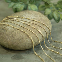 
              Multi-Chain Goldtone Necklace
            